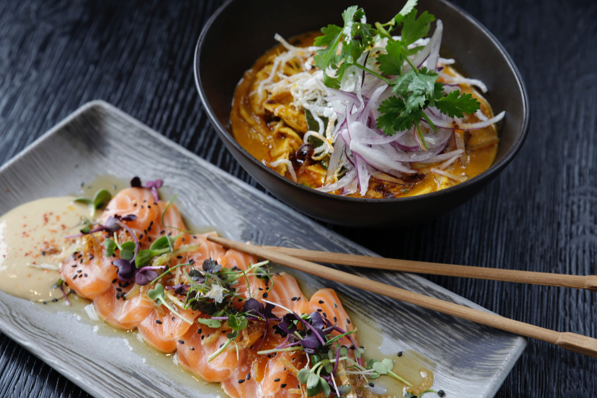 Salmon sashimi and noodle bowl.